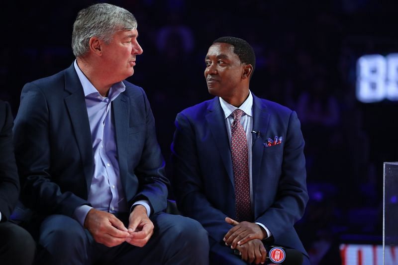 Former Detroit Piston Isiah Thomas talks to teammate Bill Laimbeer during a celebration of the 1989 and 1990 World Championship Detroit Pistons at halftime during a game between the Portland Trail Blazers and Detroit Pistons at Little Caesars Arena on March 30, 2019 in Detroit, Michigan.