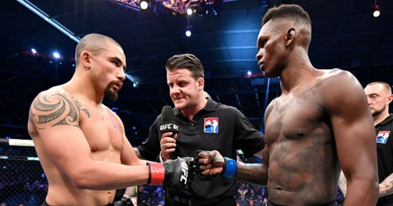 Robert Whittaker (left) and Israel Adesanya (right)