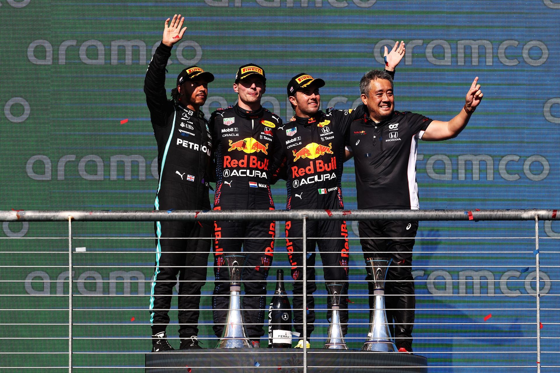 (L-R) Lewis Hamilton, Max Verstappen, Sergio Perez and Masashi Yamamoto of Honda celebrate on the podium after the 2021 USGP. (Photo by Chris Graythen/Getty Images)
