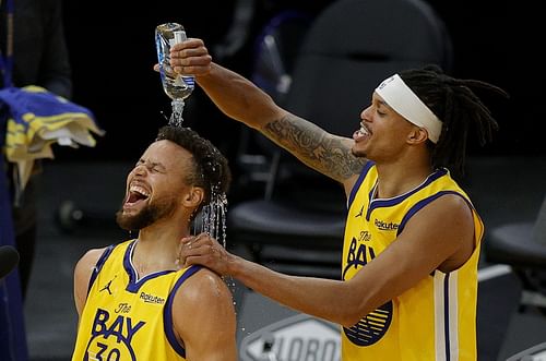 Stephen Curry and Damion Lee of the Golden State Warriors