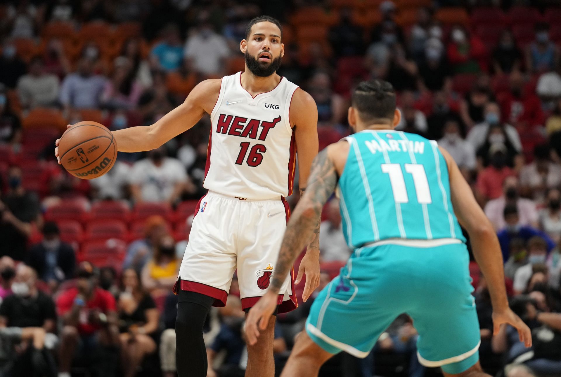 Caleb Martin goes head to head against Cody Martin in the Miami Heat vs Charlotte Hornets matchup