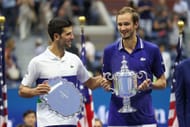 Novak Djokovic and Daniil Medvedev share a moment after the US Open Men's Final at New York in September 2021
