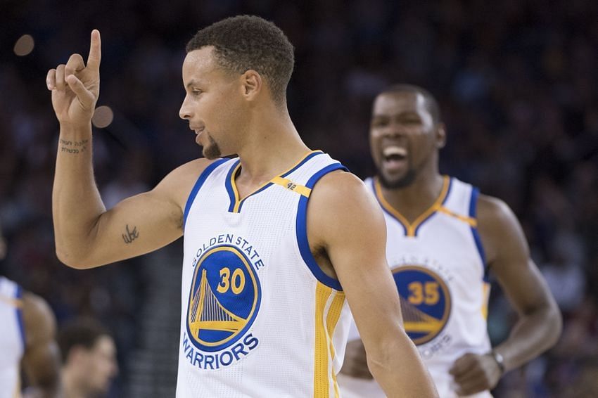 Stephen Curry and Kevin Durant (off focus) of the Golden State Warriors in the 2016-17 NBA preseason [Source: USA Today]