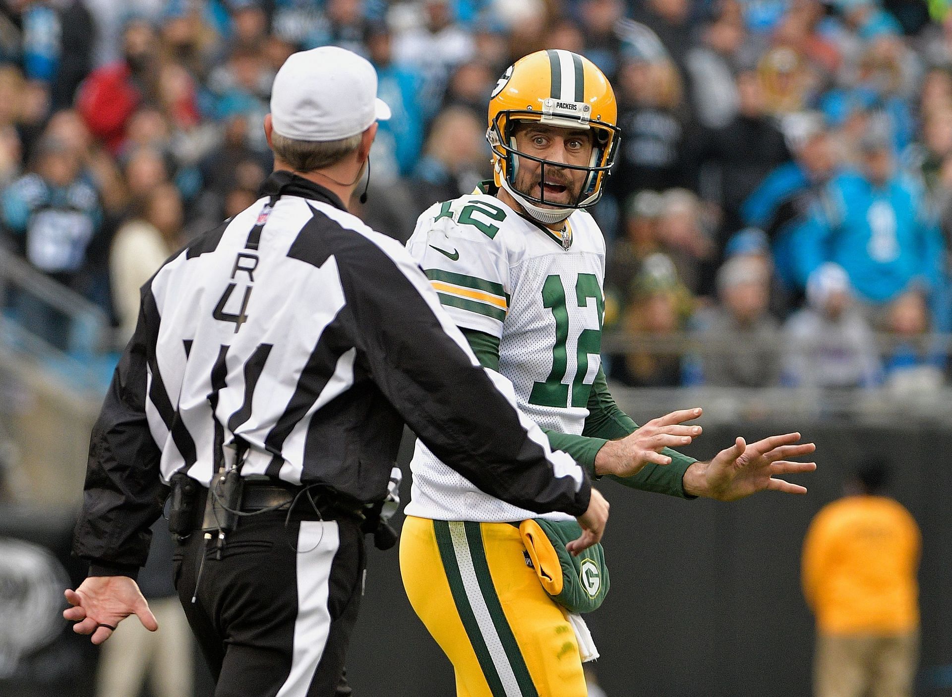 Packers quarterback Aaron Rodgers alerts the ref to a face mask call after  getting sacked during the 1st half of Green Bay's NFL game against the  Seattle Seahawks in Seattle, Washington, Monday