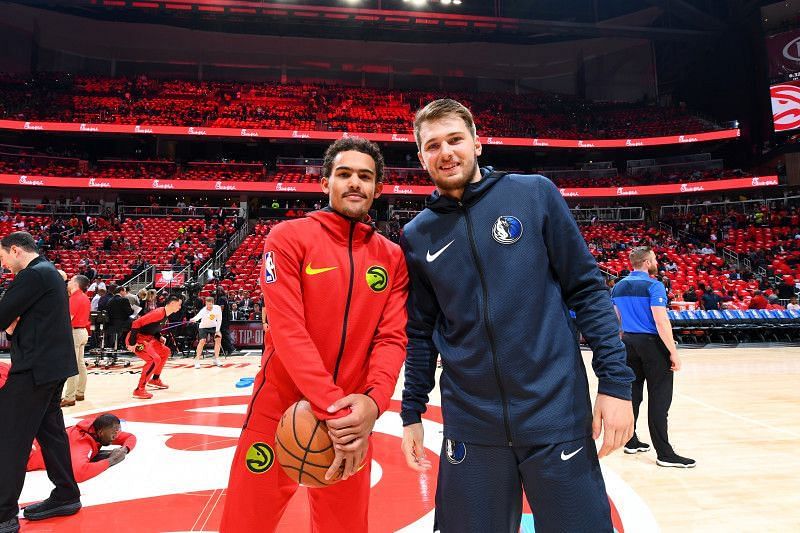 Luka Doncic of the Dallas Mavericks with Trae Young of the Atlanta Hawks