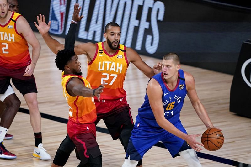 Donovan Mitchell and Rudy Gobert double teaming Nikola Jokic of the Denver Nuggets