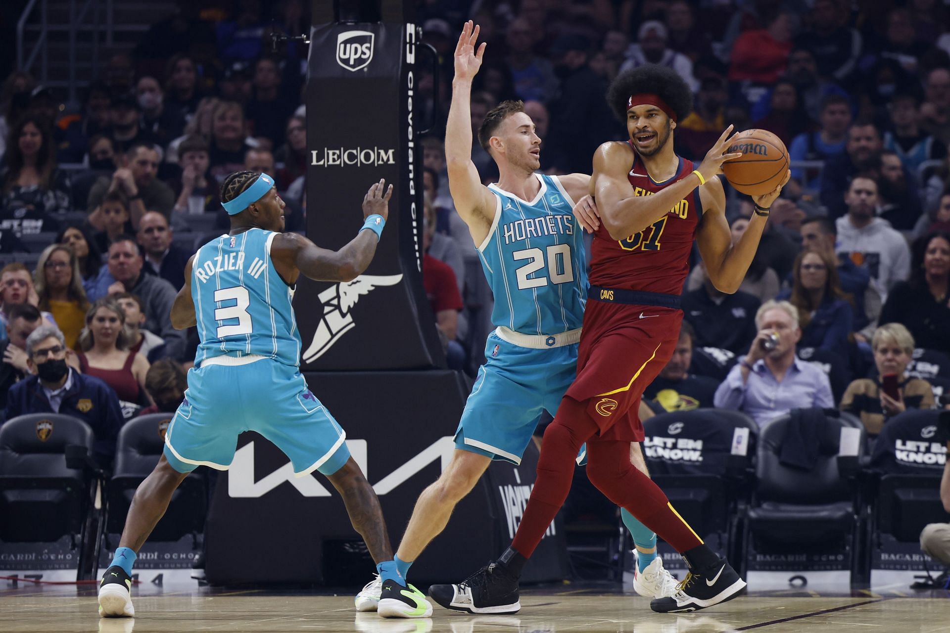 Jarret Allen surveying the court while being guarded by Gordon Hayward