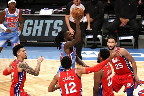 The Philadelphia 76ers' defense gang up on a drive in a game against the Brooklyn Nets last season.