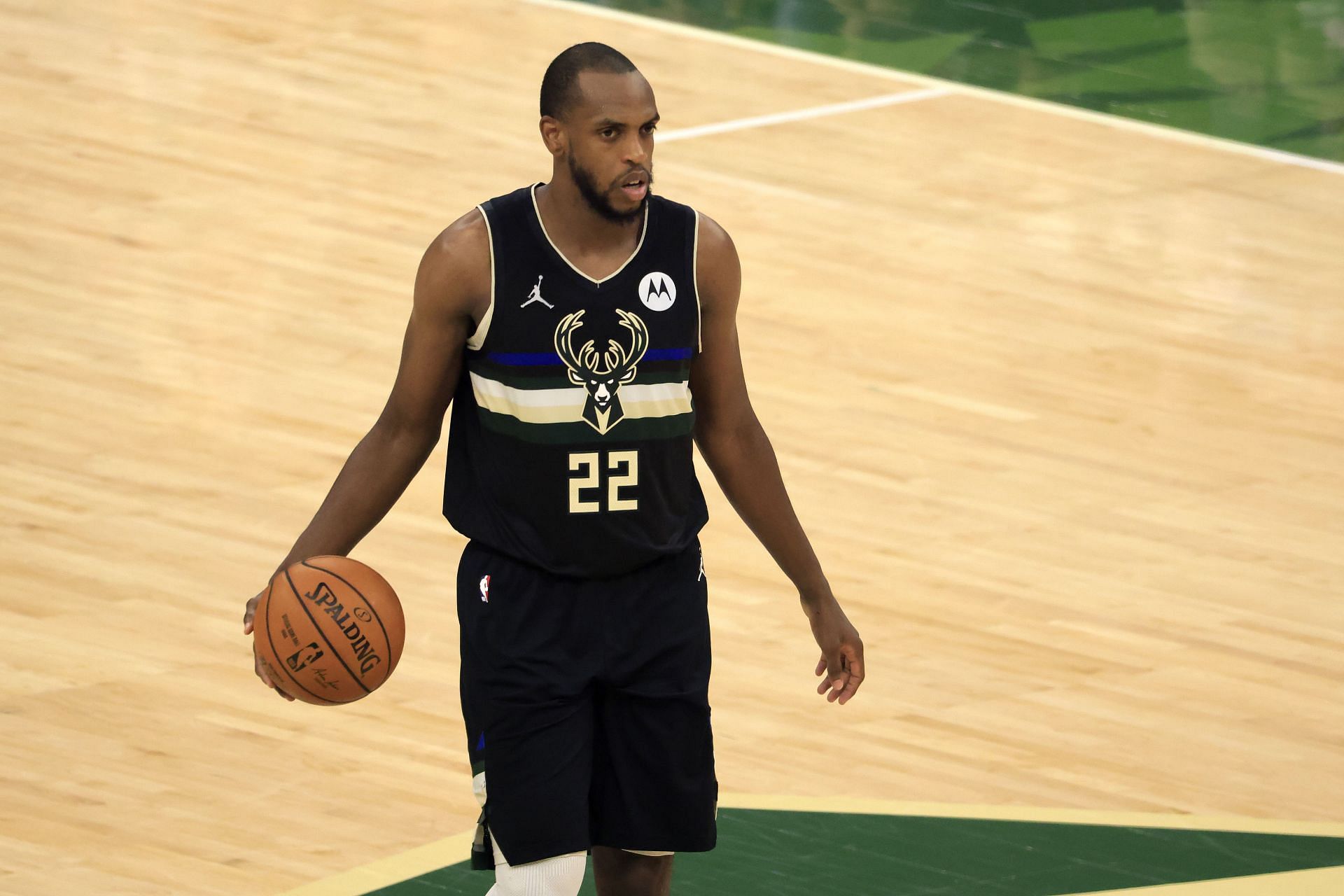 Khris Middleton #22 of the Milwaukee Bucks brings the ball up court against the Phoenix Suns during the first half in Game Six of the NBA Finals at Fiserv Forum on July 20, 2021 in Milwaukee, Wisconsin.