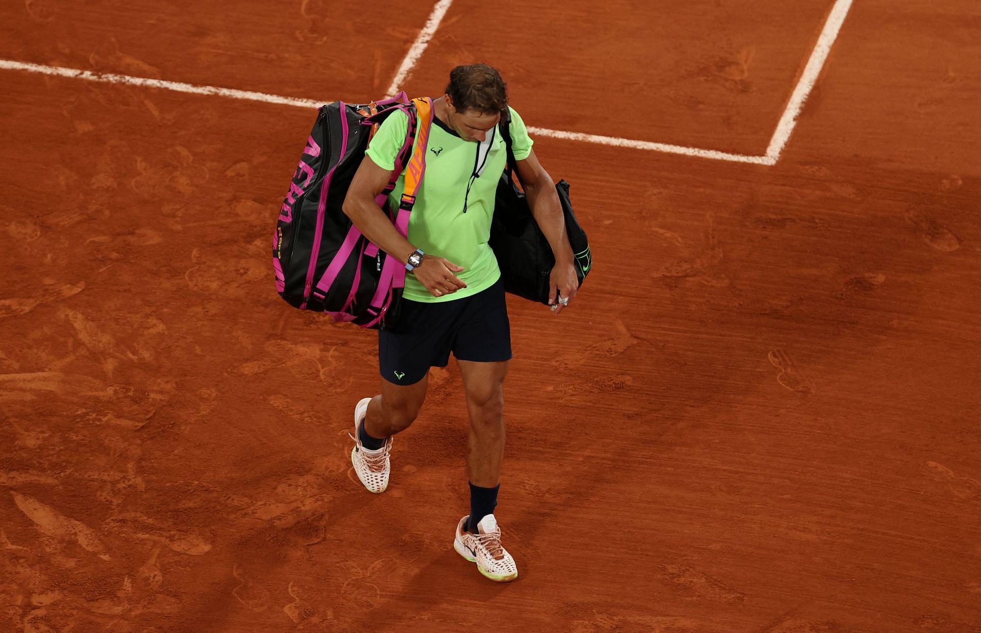 Rafael Nadal leaves the court after losing to Novak Djokovic at the 2021 French Open
