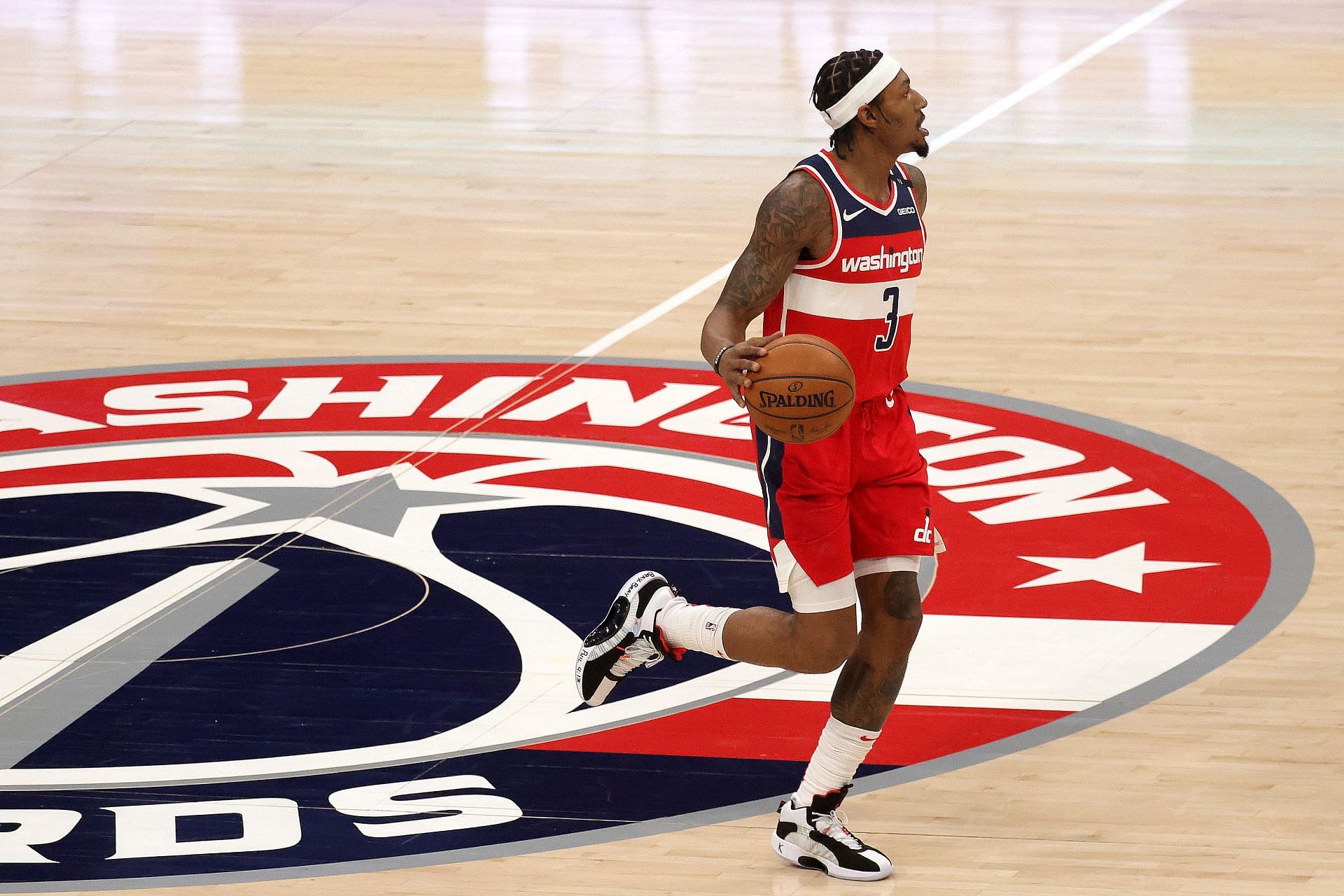 Bradley Beal #3 of the Washington Wizards dribbles the ball against the Chicago Bulls in the first half at Capital One Arena on December 31, 2020 in Washington, DC.