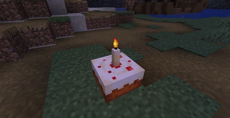 A candle on a cake (Image via Minecraft)