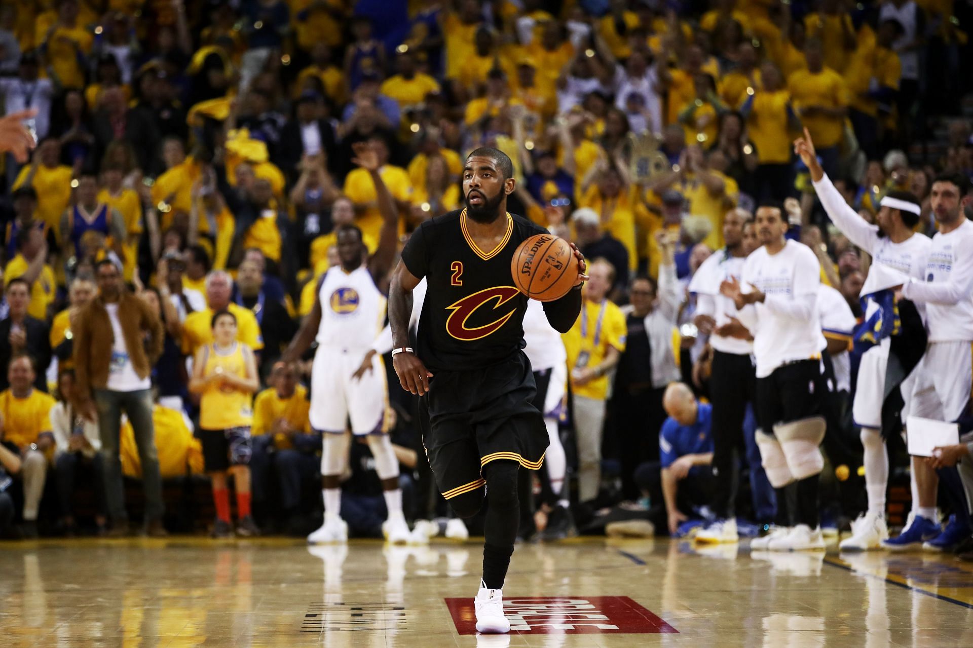 Kyrie Irving (#2) of the Cleveland Cavaliers handles the ball against the Golden State Warriors.