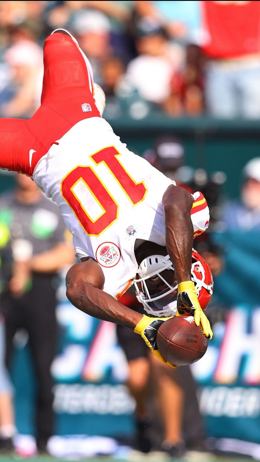 Kansas City Chiefs wide receiver Tyreek Hill (10) jumps into the