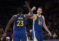 Nemanja Bjelica #8 of the Golden State Warriors is congratulated by Draymond Green.