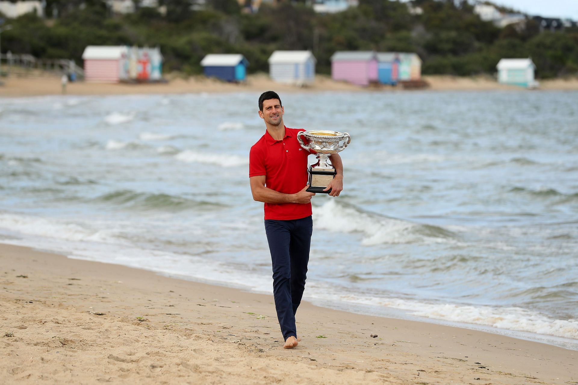 Novak Djokovic with his 2021 Australian Open title at the Brighton Beach in Melbourne