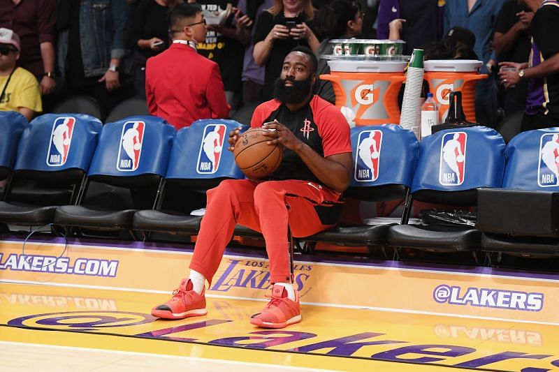 James Harden #13 of the Houston Rockets looks on from the bench during warm-ups before the game between the Houston Rockets and the Los Angeles Lakers