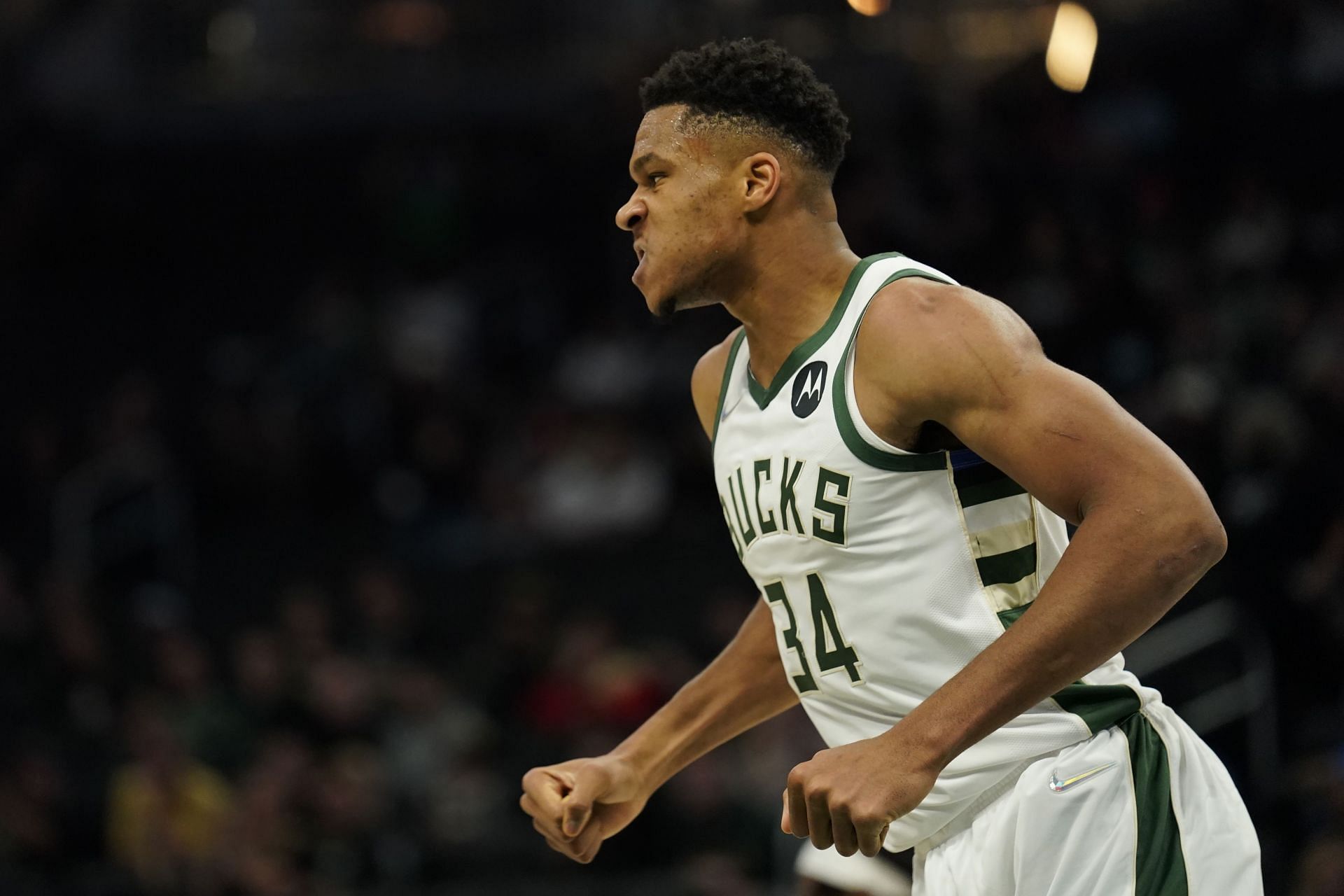 Giannis Antetokounmpo #34 of the Milwaukee Bucks reacts after making a basket against the Oklahoma City Thunder in the first half during a preseason game at Fiserv Forum on October 10, 2021 in Milwaukee, Wisconsin.