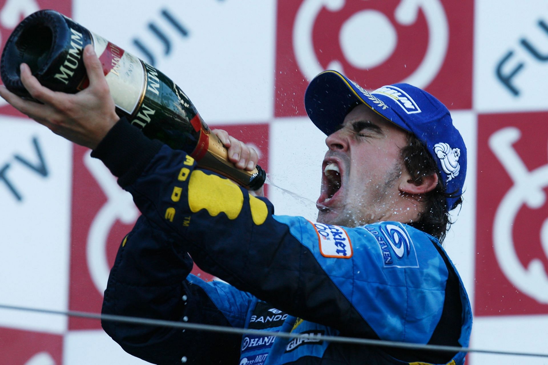World Champion Fernando Alonso of Spain and Renault celebrates his victory during the 2006 Japanese Grand Prix at Suzuka Circuit . (Photo by Mark Thompson/Getty Images)
