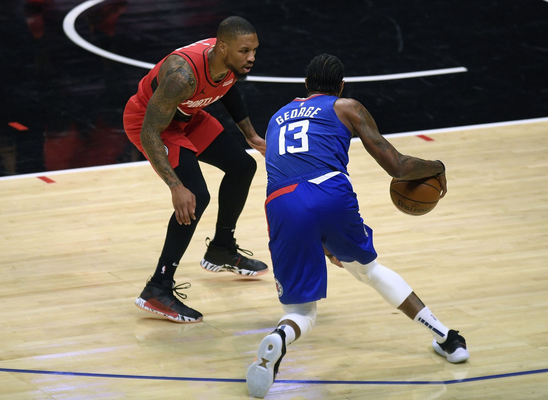 Damian Lillard of the Portland Trail Blazers and Paul George of the Los Angeles Clippers