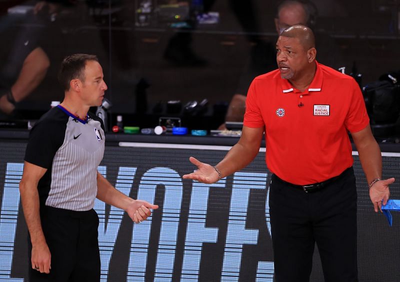 Doc Rivers talks with a referee