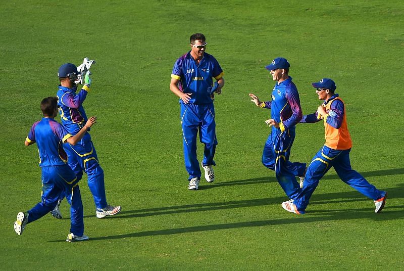 The Namibia Cricket Team celebrating the fall of a wicket