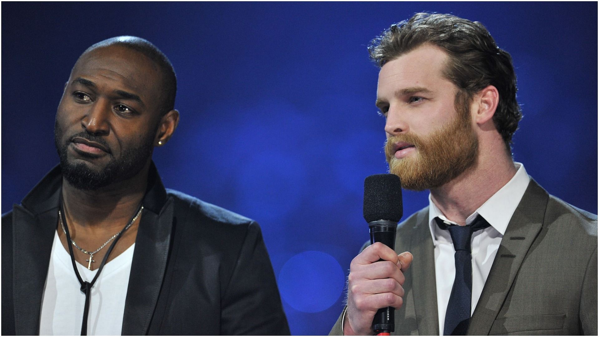 Adrian Holmes and Jared Keeso present an award at the 2015 JUNO Awards at the FirstOntario Centre on March 15, 2015, in Hamilton, Canada (Image via Getty Images)