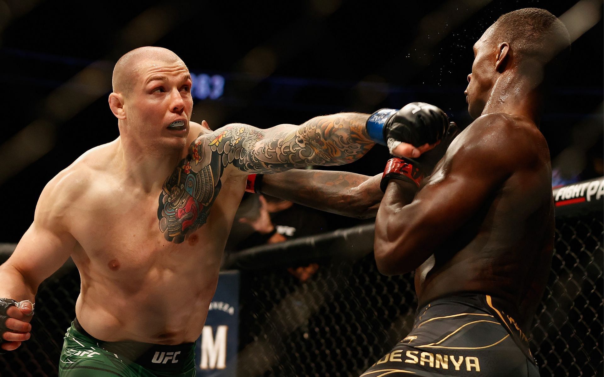 UFC middleweight contender Marvin Vettori (left) in action against champion Israel Adesanya (right)