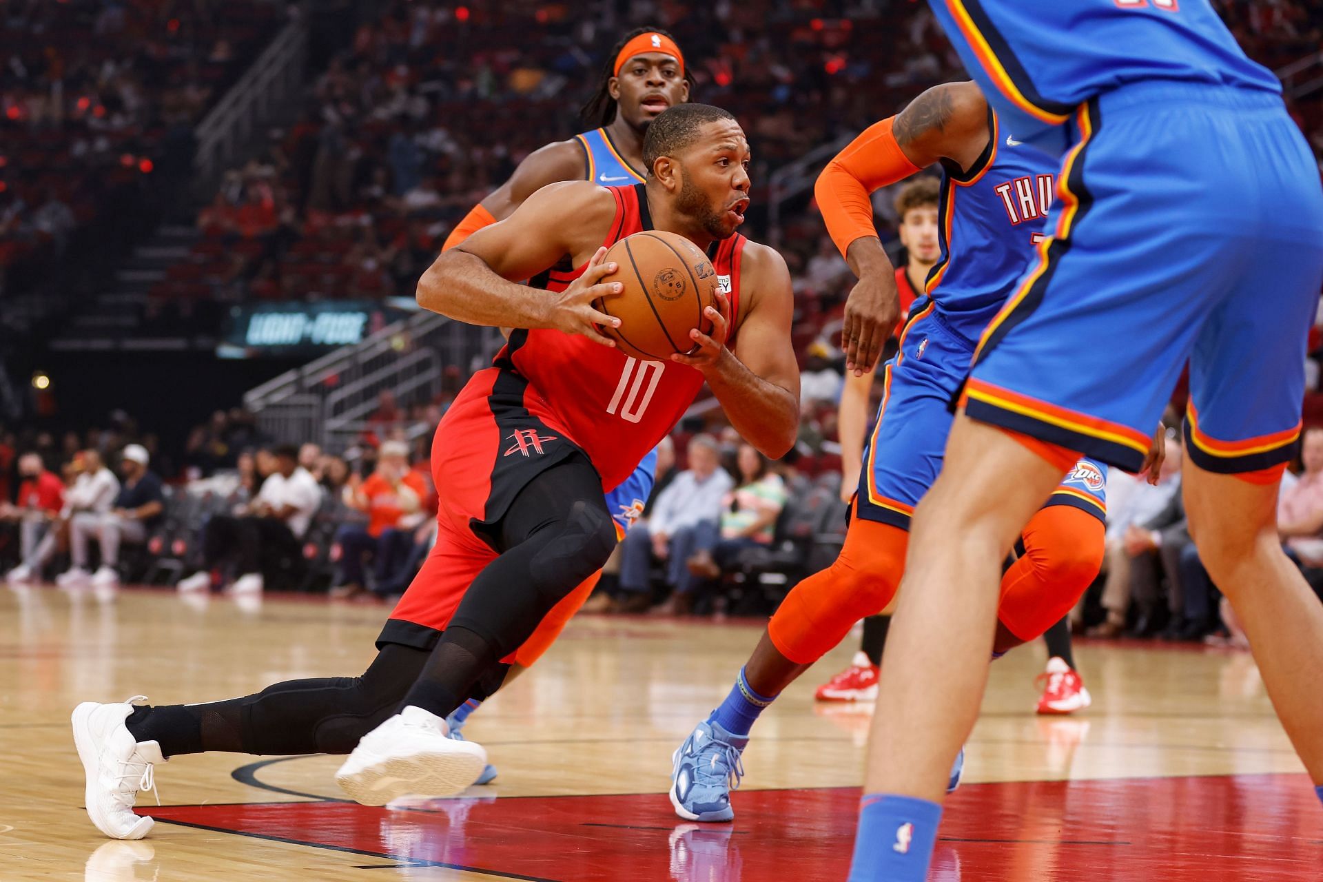 Eric Gordon #10 of the Houston Rockets drives to the basket in the first half against the Oklahoma City Thunder at Toyota Center on October 22, 2021 in Houston, Texas.