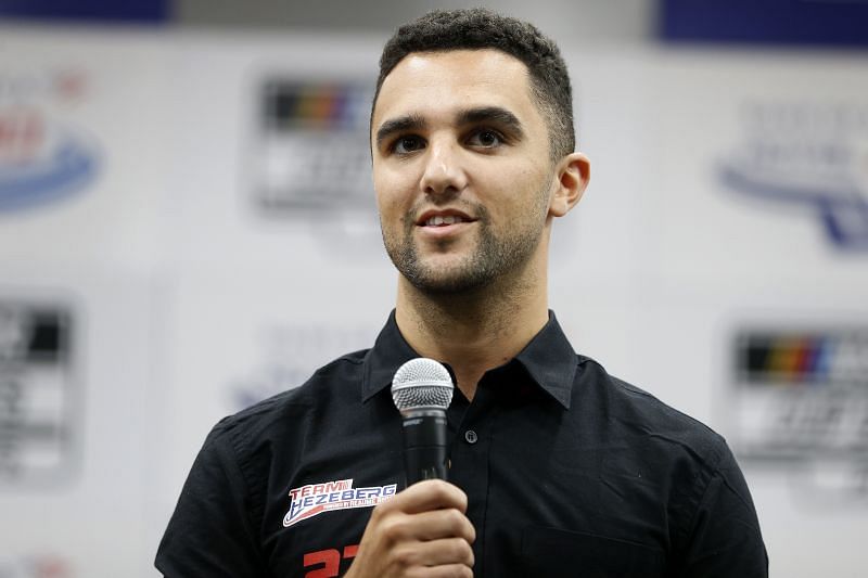 Driver Loris Hezemans, speaks at a press conference announcing he will drive the #27 Next Gen car in selected races of the 2022 NASCAR Cup Series for Team Hezeberg owners Toine Hezemans and Ernst Berg prior to the NASCAR Xfinity Series Drive for the Cure 250 presented by Blue Cross Blue Shield of North Carolina at Charlotte Motor Speedway on October 09, 2021 in Concord, North Carolina. (Photo by Brian Lawdermilk/Getty Images)