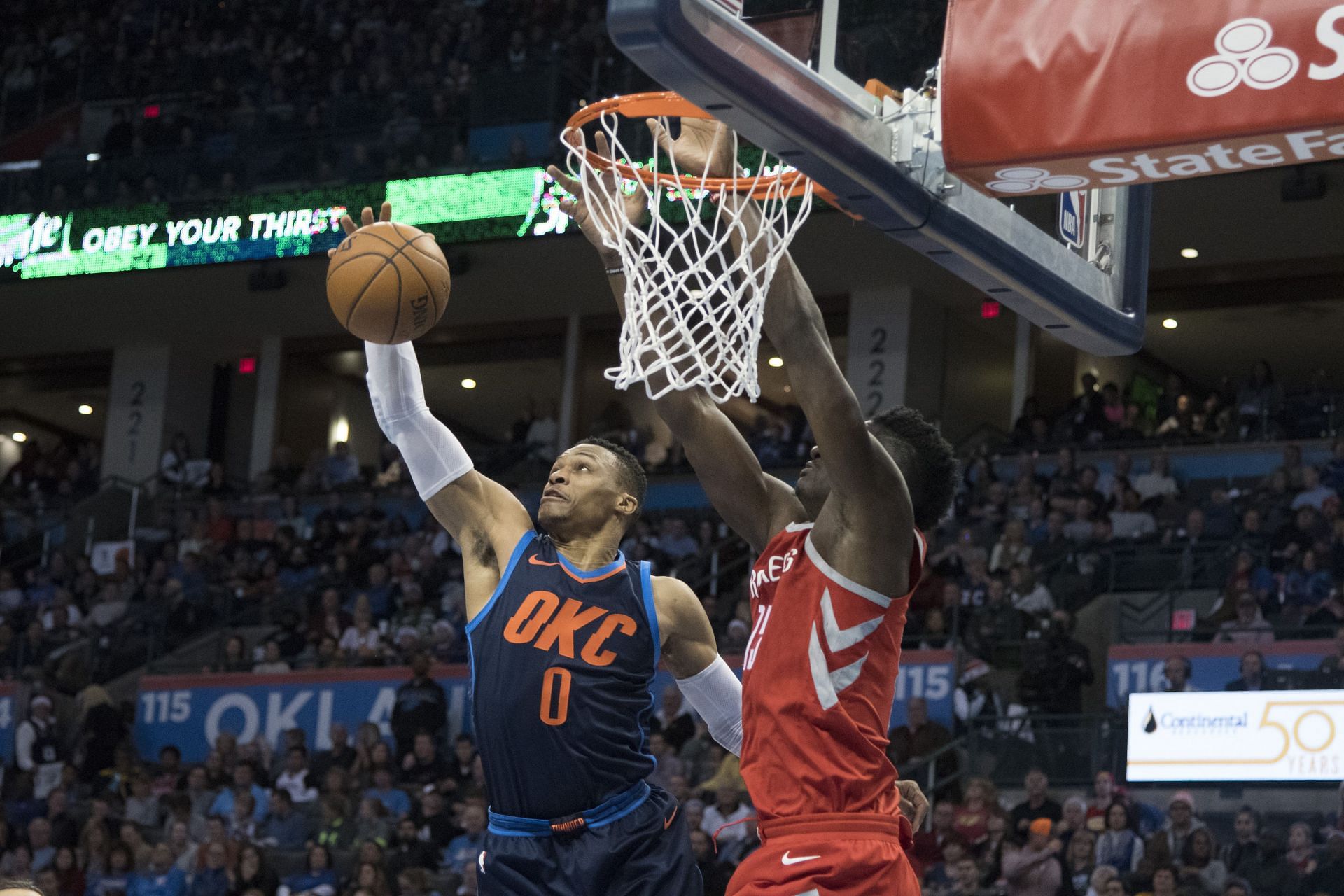 Russell Westbrook #0 of the Oklahoma City Thunder rebounds a ball after Clint Capela #15 of the Houston Rockets shot