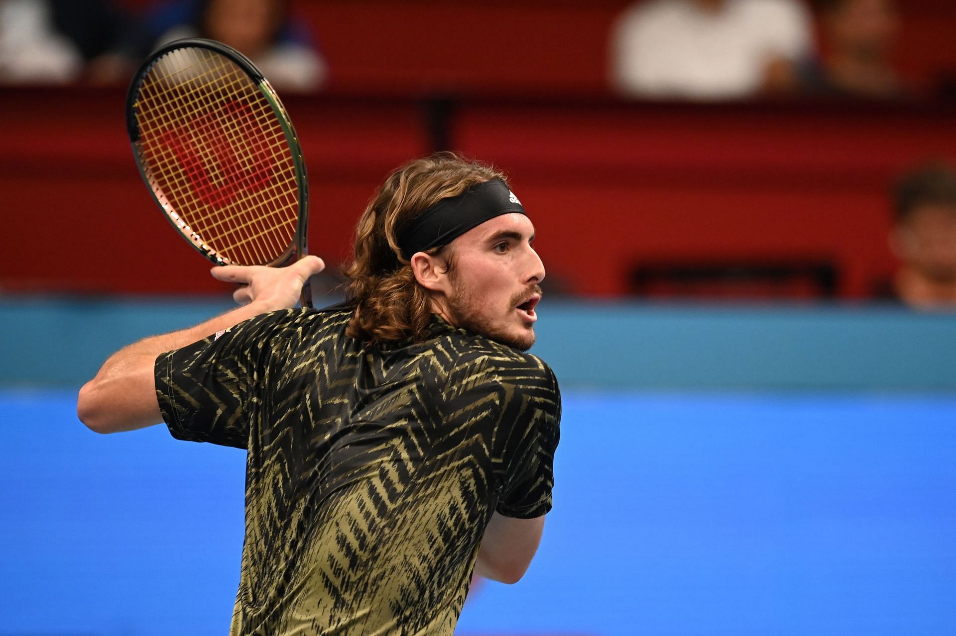 Stefanos Tsitsipas attempts to hit a backhand at the Erste Bank Open