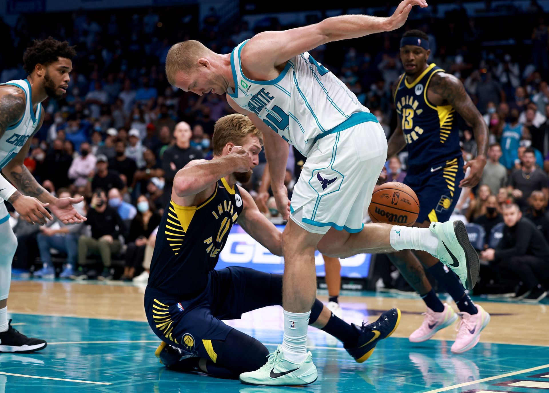 Domantas Sabonis of the Indiana Pacers grapples with Plumlee of the Charlotte Hornets