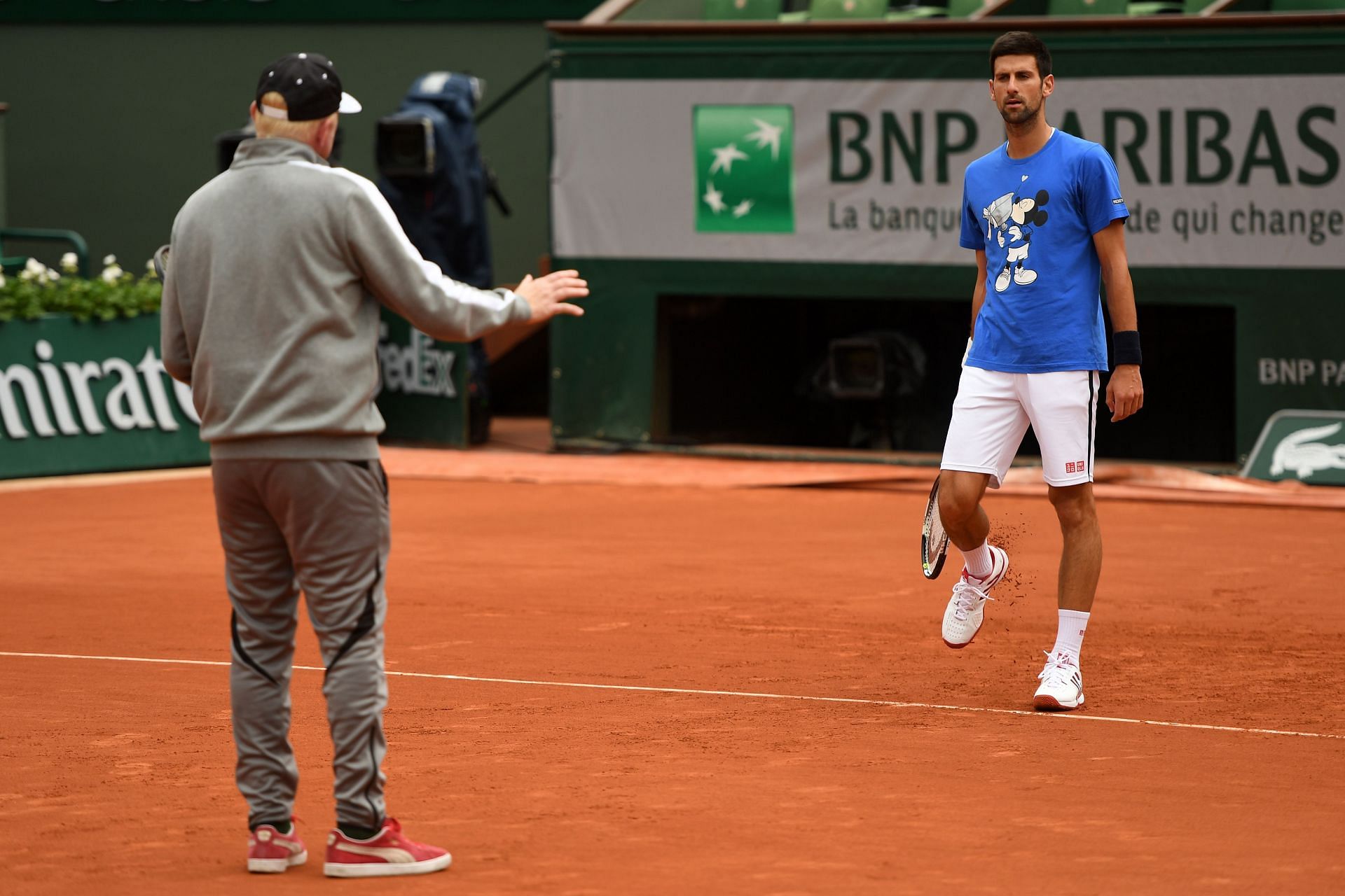 Boris Becker working with Novak Djokovic at the 2016 French Open