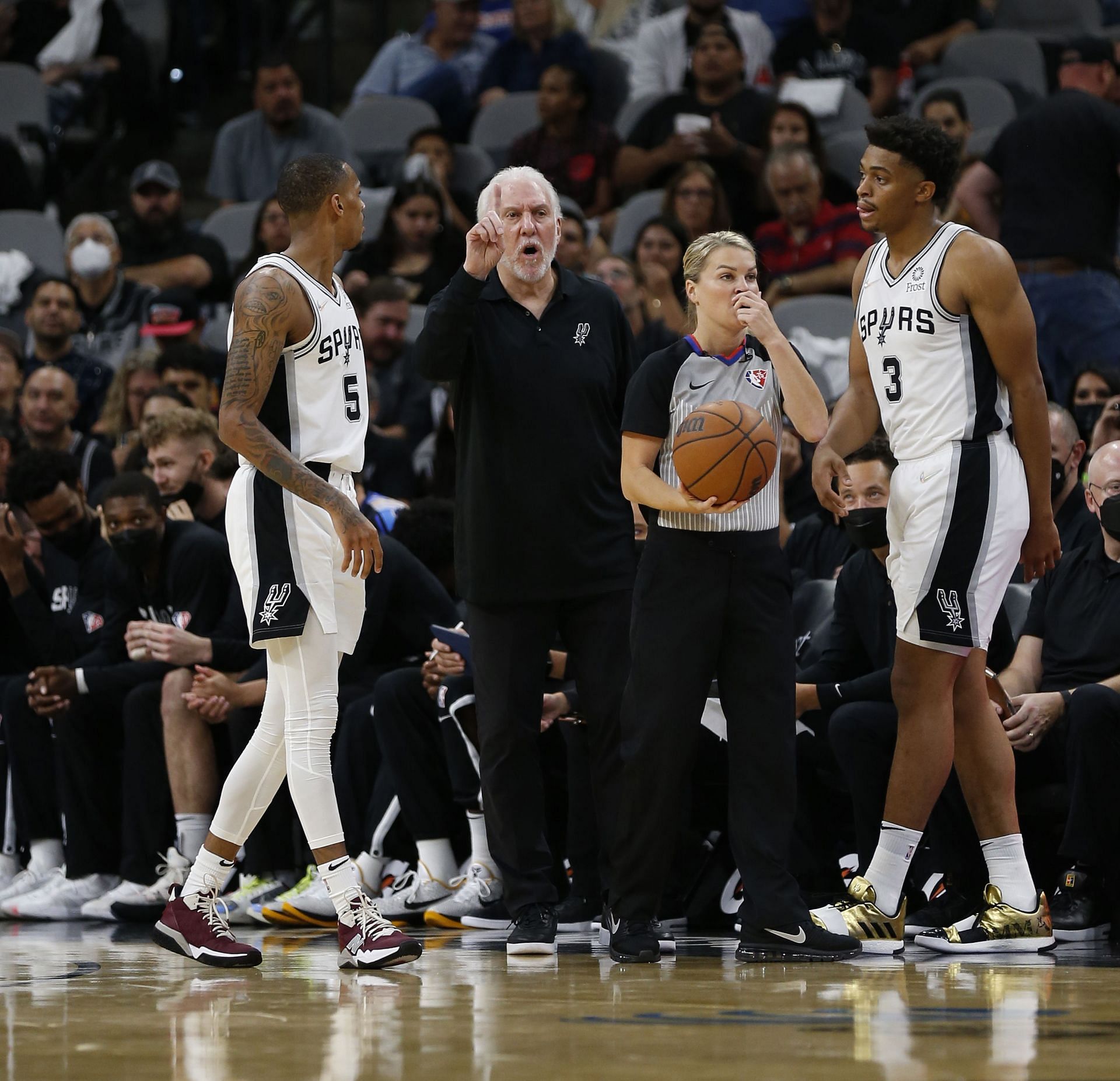 San Antonio Spurs coach Gregg Popovich talking to Dejounte Murray