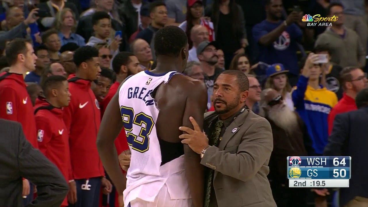 Draymond Green of the Golden State Warriors walks off with a torn jersey [Source: Bleacher Report]