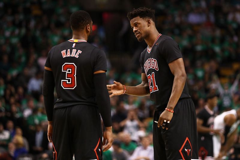 Jimmy Butler (#21) of the Chicago Bulls talks with Dwyane Wade (#3) in 2017.