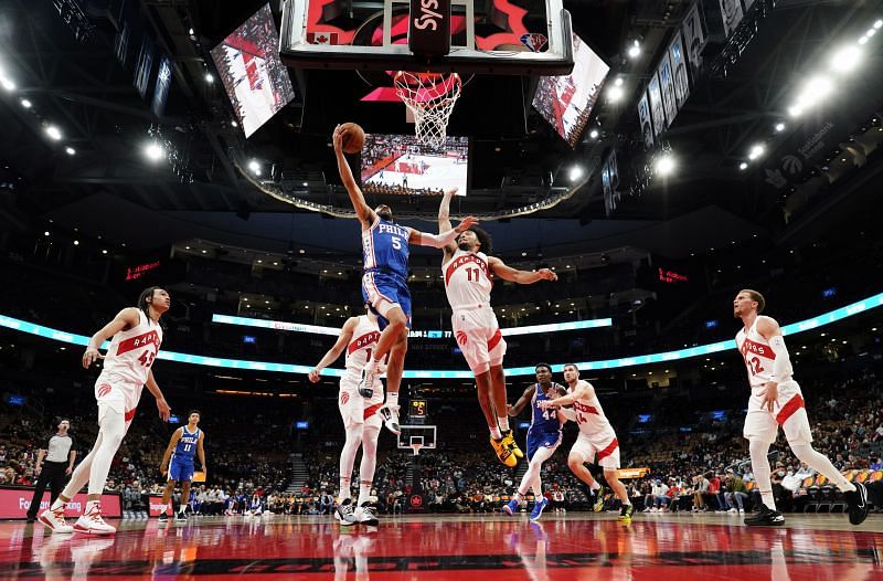 Justin Champagnie #11 goes for the block against the 76ers