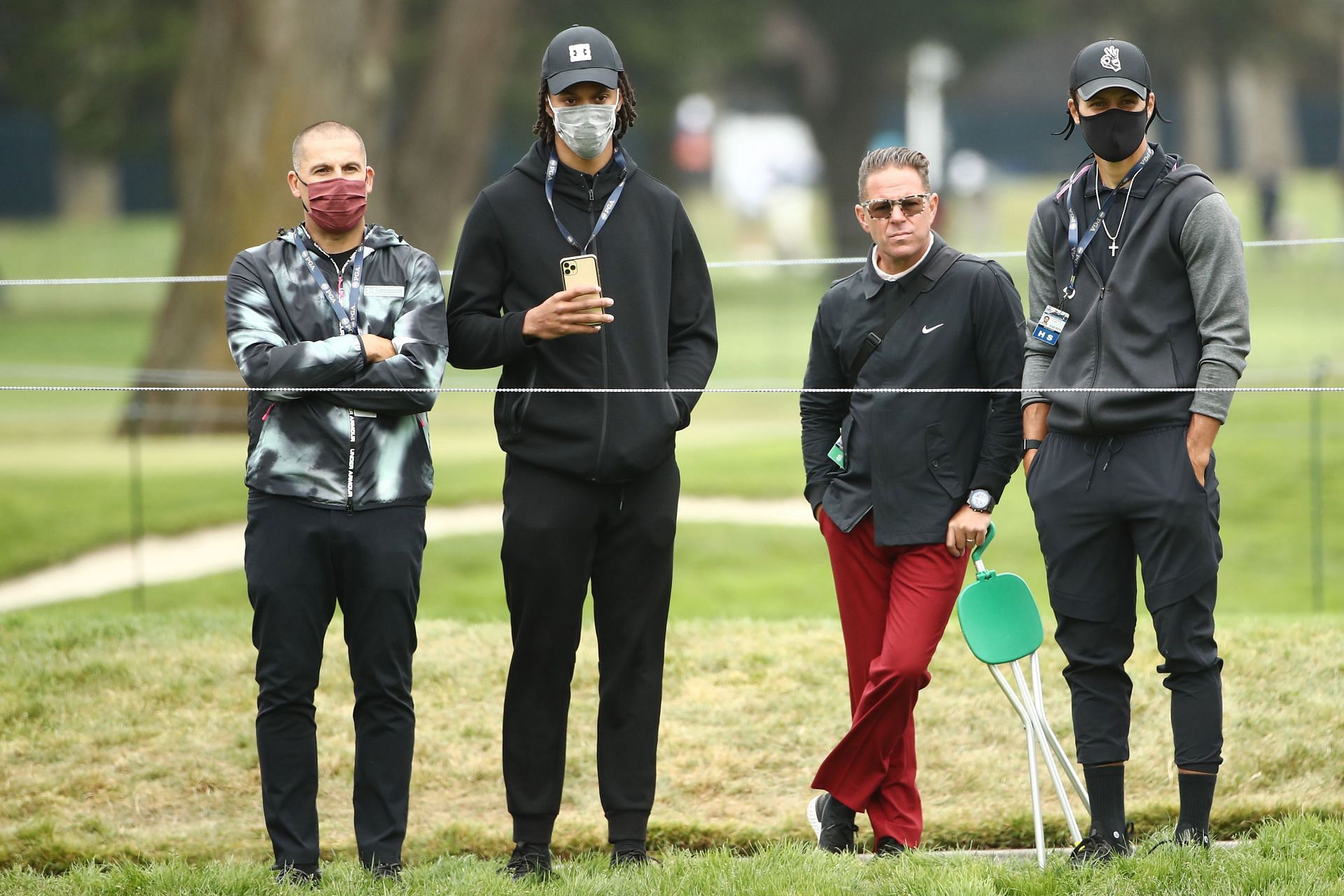 Damion Lee and Stephen Curry watching the PGA Tour