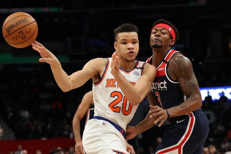 Kevin Knox II #20 of the New York Knicks dribbles past Bradley Beal #3 of the Washington Wizards during the first half at Capital One Arena on March 10, 2020 in Washington, DC.