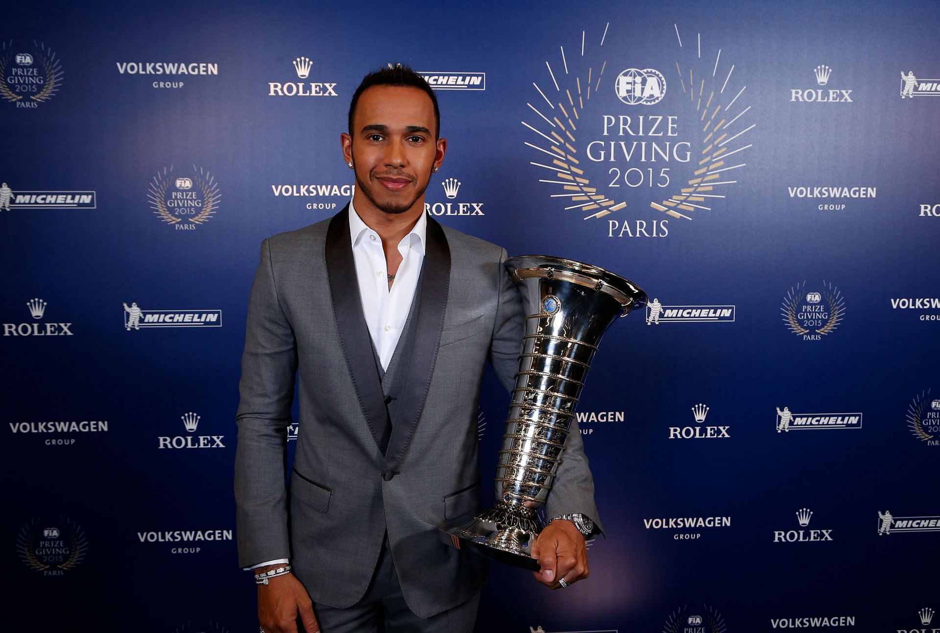 World Champion Lewis Hamilton of Great Britain poses with the Drivers&#039; Championship trophy during the 2015 FIA Prize-Giving Ceremony at the Lido Theatre in Paris, France. (Photo by Jean Michel Le Meur - Pool/Getty Images)