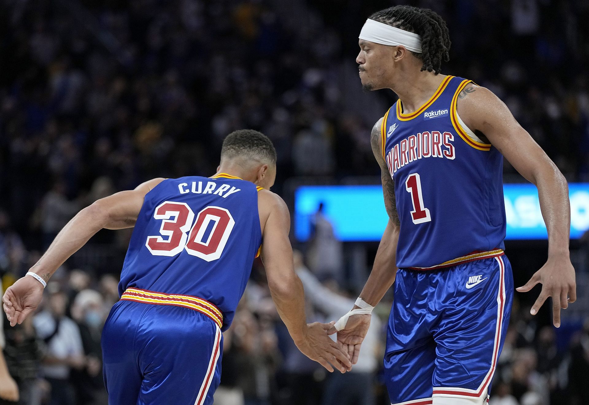 Damion Lee and Stephen Curry in action for the Golden State Warriors