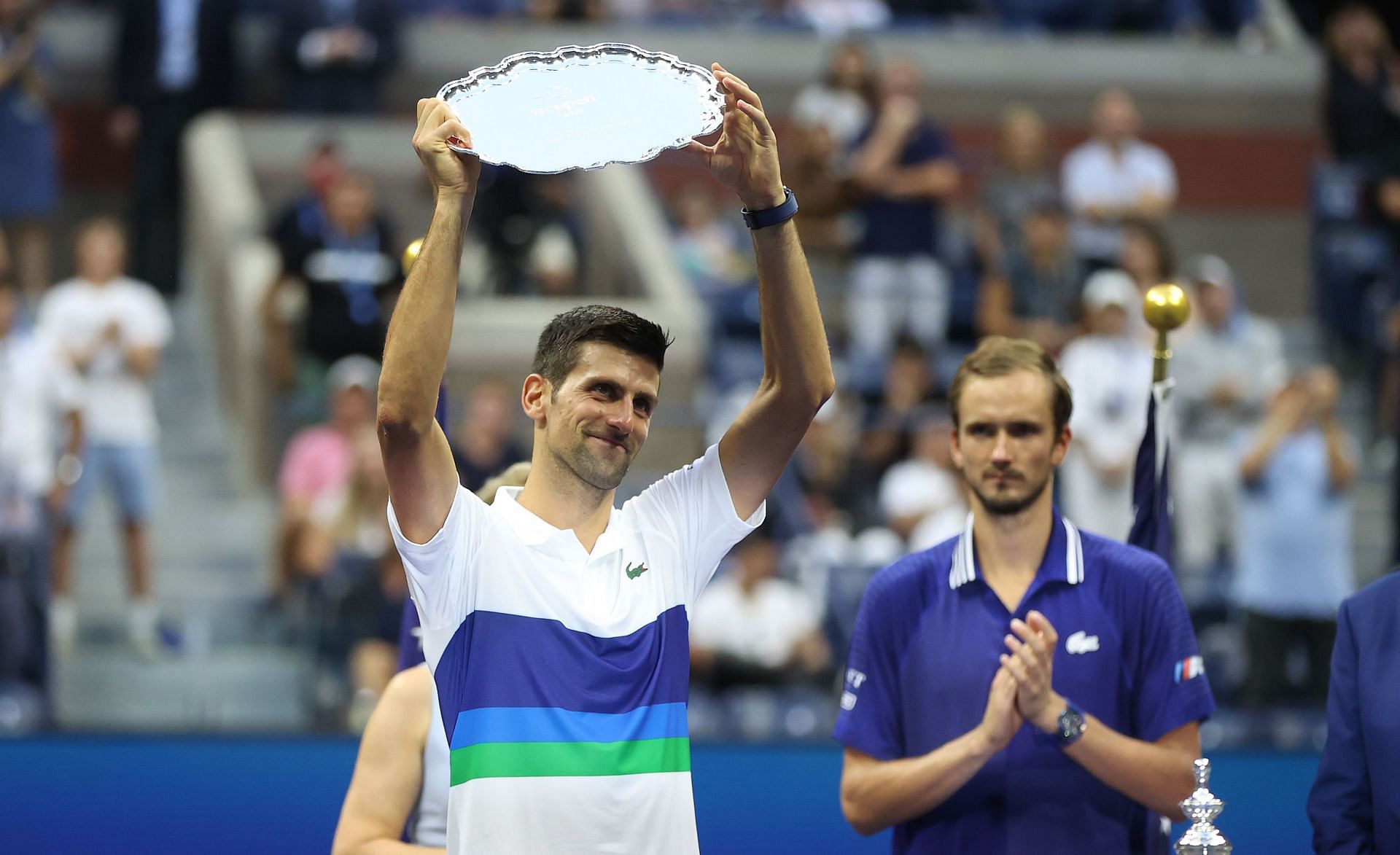 Novak Djokovic holds aloft the runners-up plate at the 2021 US Open