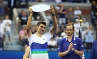 Novak Djokovic holds aloft the runners-up plate at the 2021 US Open