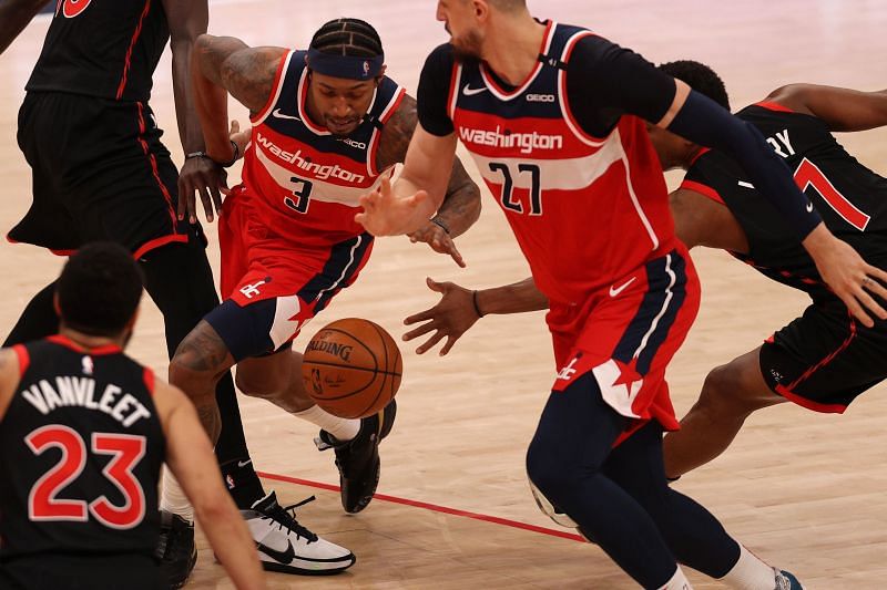 Bradley Beal of the Washington Wizards splits the defense of the Toronto Raptors