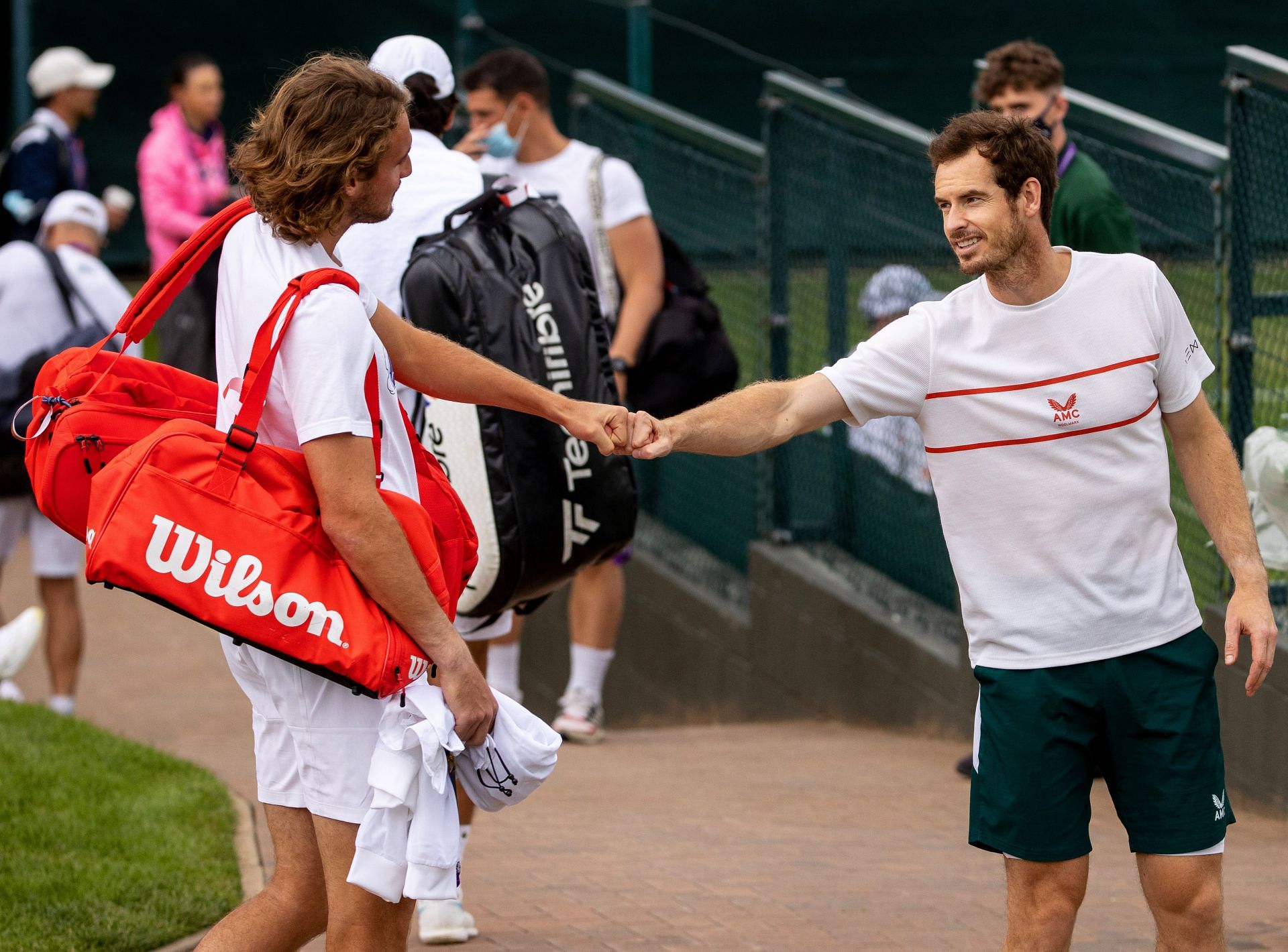 Stefanos Tsitsipas (L) and Andy Murray at Wimbledon 2021