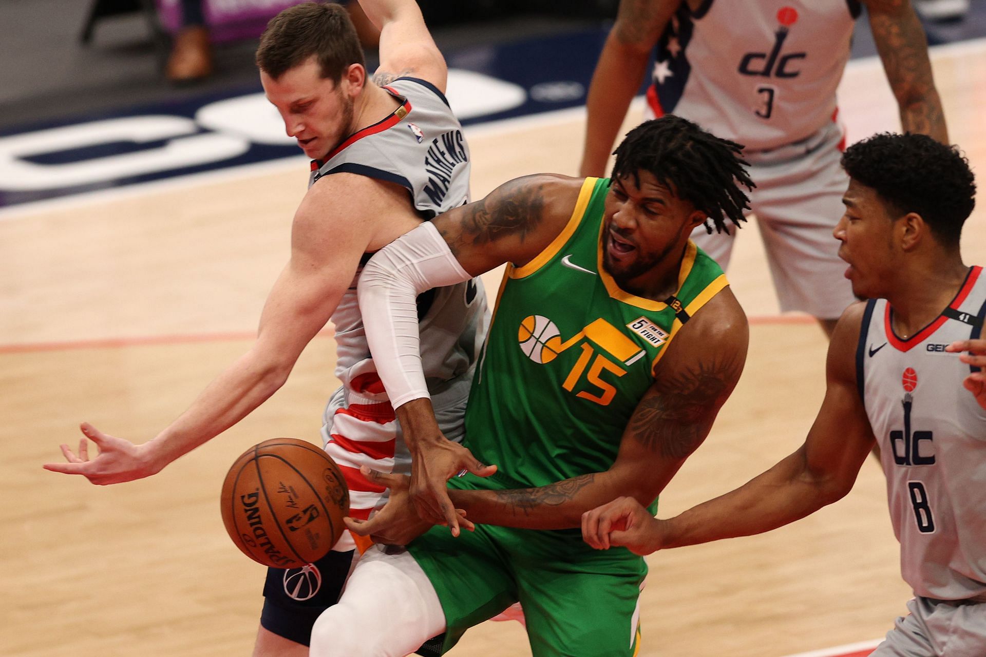 Derrick Favors battling for a rebound against the Washington Wizards