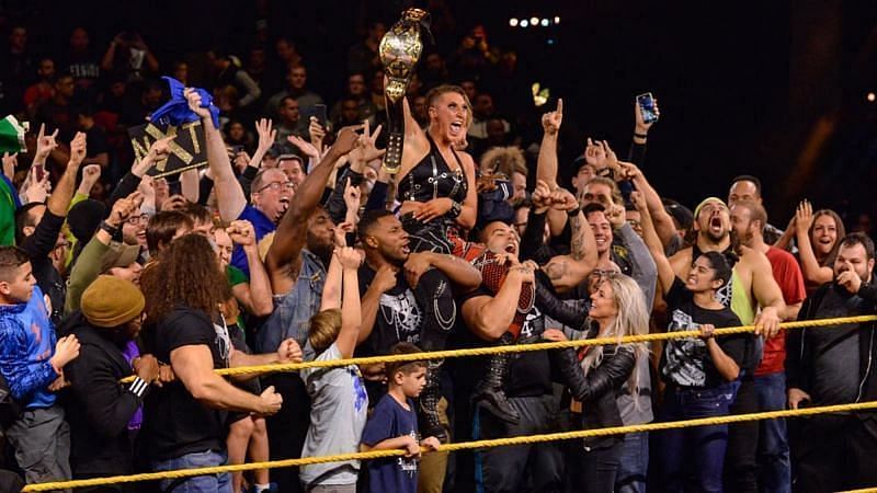 WWE Universe celebrates with Rhea Ripley in the ring at NXT