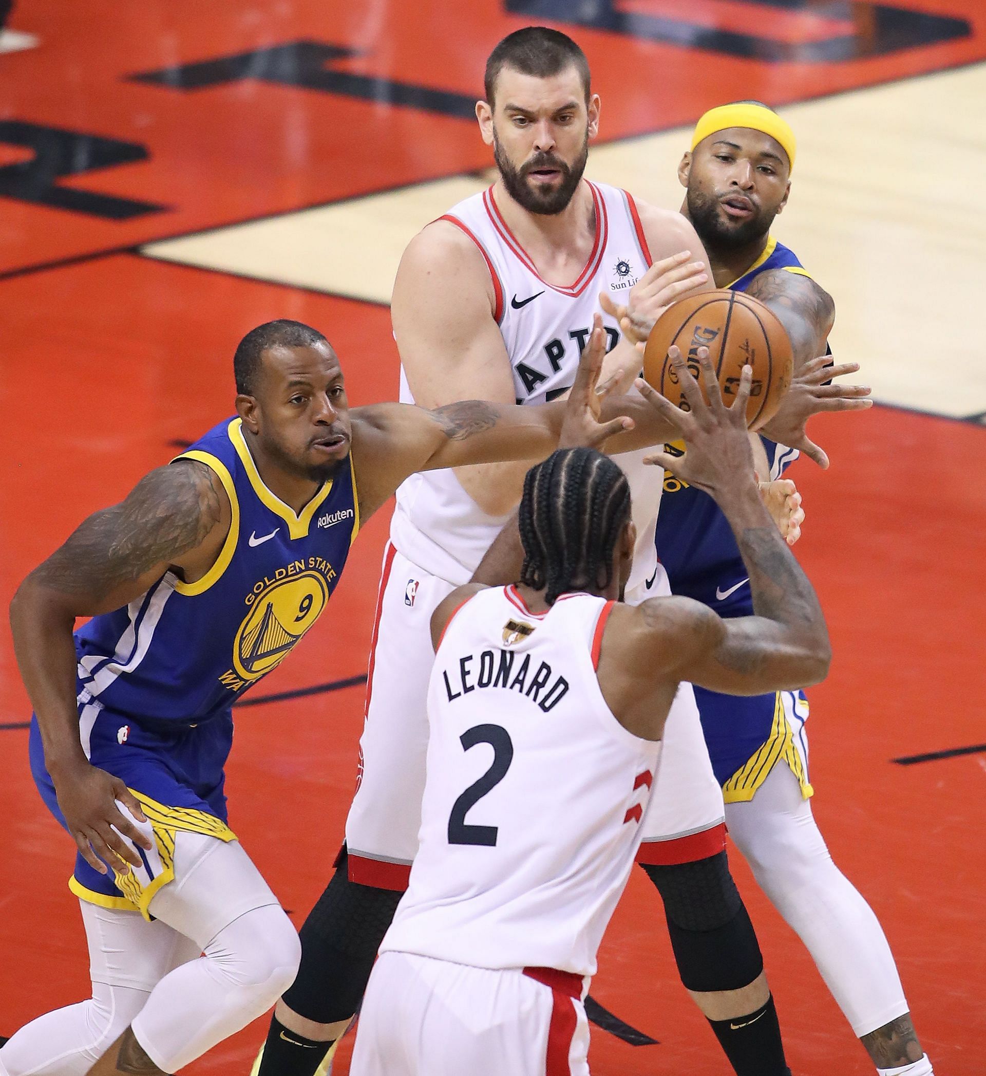 DeMarcus Cousins #0 and Andre Iguodala #9 of the Golden State Warriors battle against Marc gasol #33 and Kawhi Leonard #2 of the Toronto Raptors during Game Five of the 2019 NBA Finals at Scotiabank Arena on June 10, 2019 in Toronto, Canada.