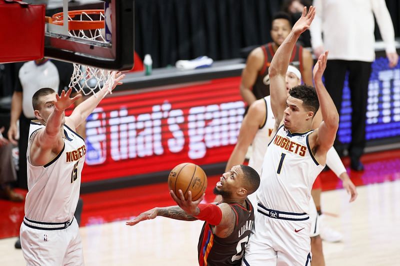 Damian Lillard hitting a tough shot against the Denver Nuggets